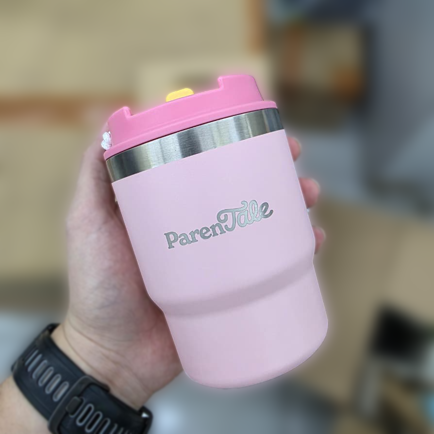 Quppa custom pink tumbler with custom branding held by a person